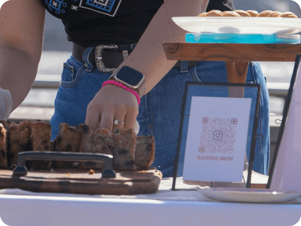 A pop-up table with one code for the shop, socials, and list.